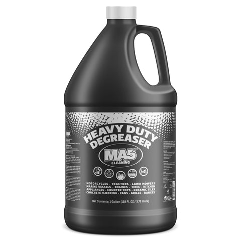 Black 1-gallon container of MA5x Cleaning Heavy Duty Degreaser with bold white text on a black label. Suitable for cleaning engines, tires, appliances, concrete floors, grills, and more. Includes “Made in USA” and recycling symbols. Net contents: 128 FL OZ (3.78 L).