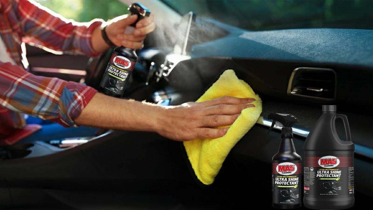 Wiping car dashboard with ultra shine protectant.